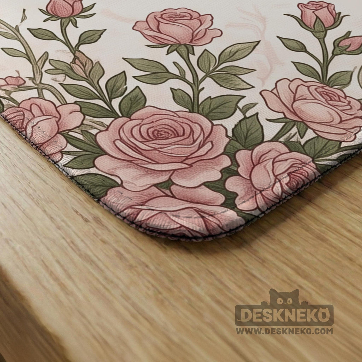 American mahjong mat with an ivory center, printed play-direction reminders, and a border of dusty-pink roses, ribbon bows, and green leaves.