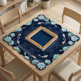 American mahjong mat with a navy-blue pond design, pale aqua lotus flowers, flowing water lines, koi fish, and printed play-direction and Charleston passing reminders.