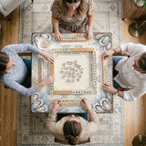 American mahjong mat with a cream center and a coastal border showing oyster shells, scallop shells, starfish, pearl strands, and pale blue sea plants.