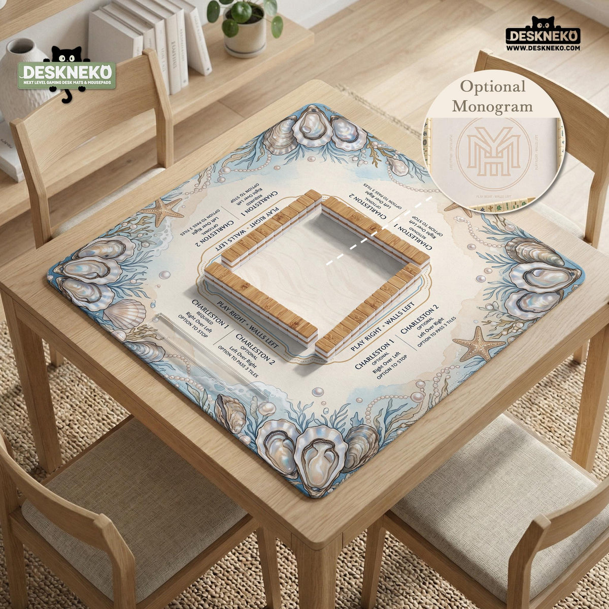 American mahjong mat with a cream center and a coastal border showing oyster shells, scallop shells, starfish, pearl strands, and pale blue sea plants.