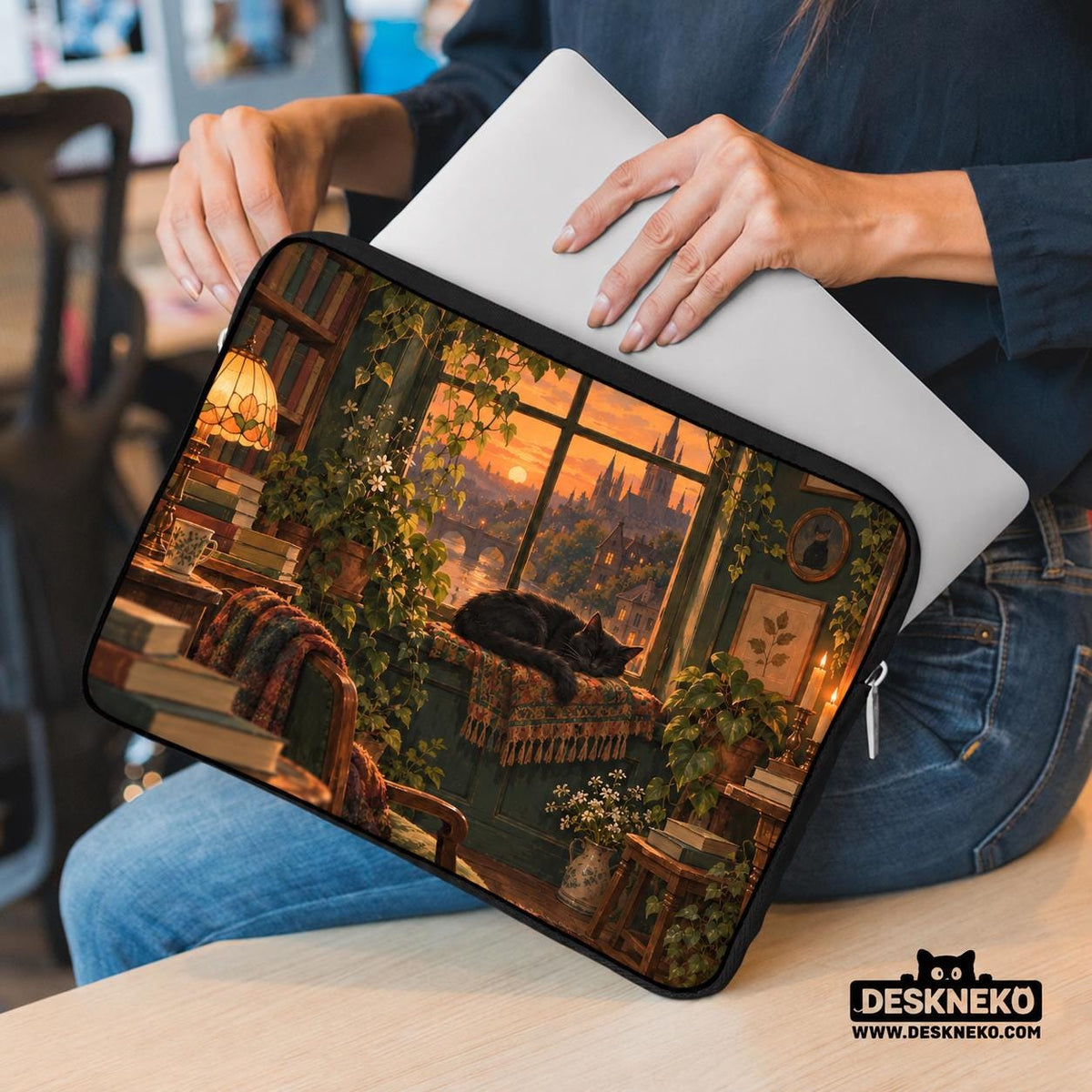 Illustration of a black cat beside stacked books and leafy plants in forest green, brown, and amber tones on a laptop sleeve and shoulder bag design.