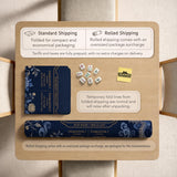 Navy mahjong mat with cranes, garden birds, pagodas, and blue and cream floral designs around a framed playing area with a printed Charleston guide.