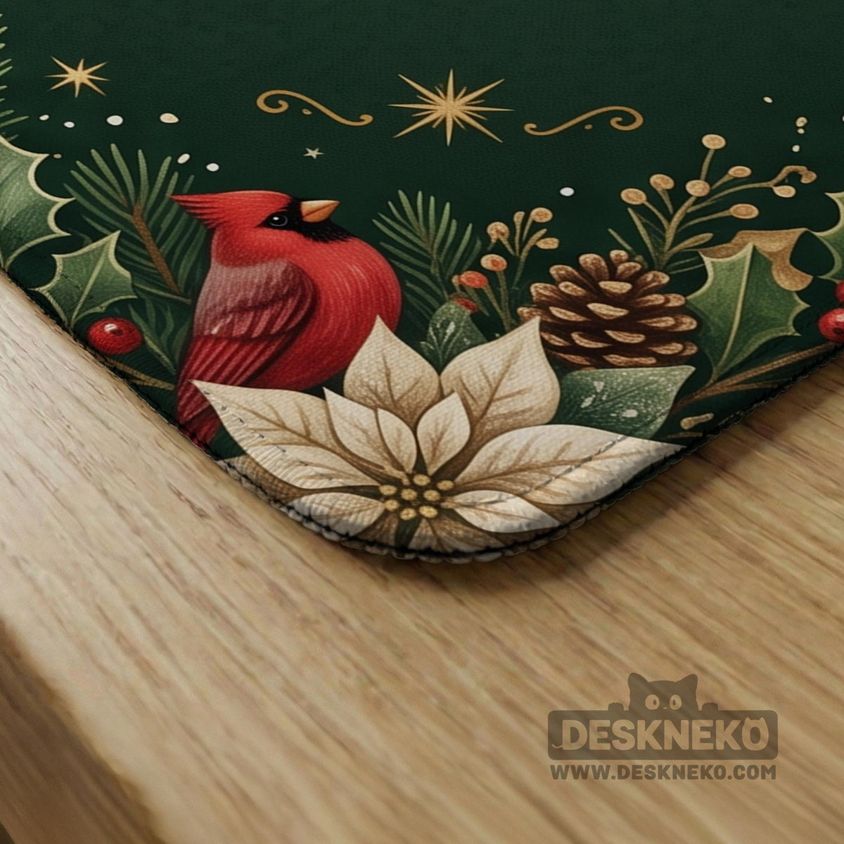 Green mahjong mat with red cardinals, holly berries, cream poinsettias, and gold seasonal details around a printed Charleston guide.