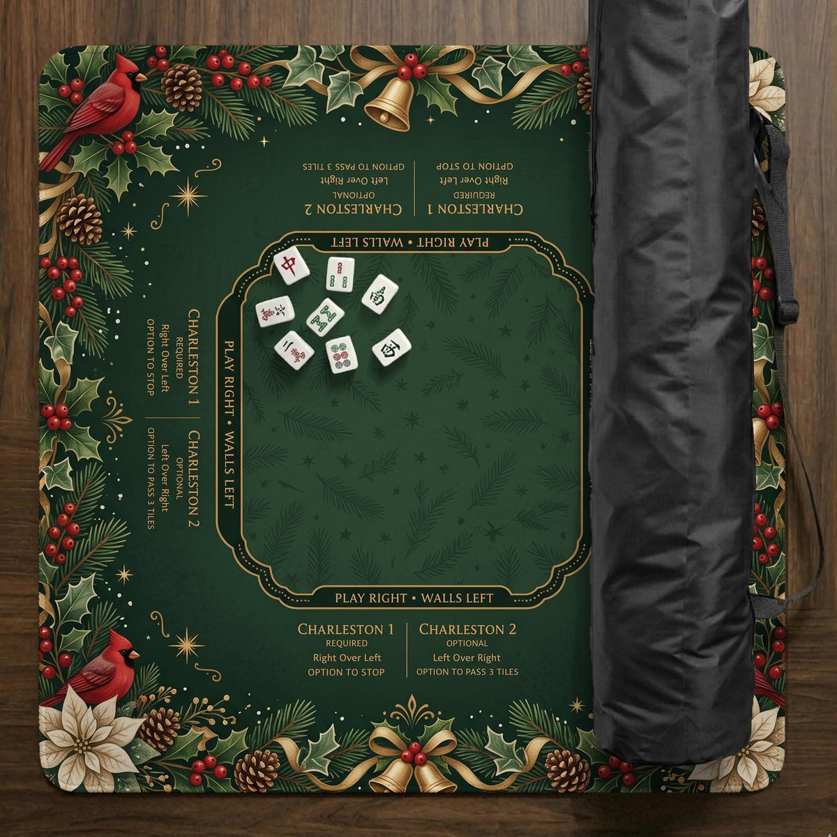 Green mahjong mat with red cardinals, holly berries, cream poinsettias, and gold seasonal details around a printed Charleston guide.