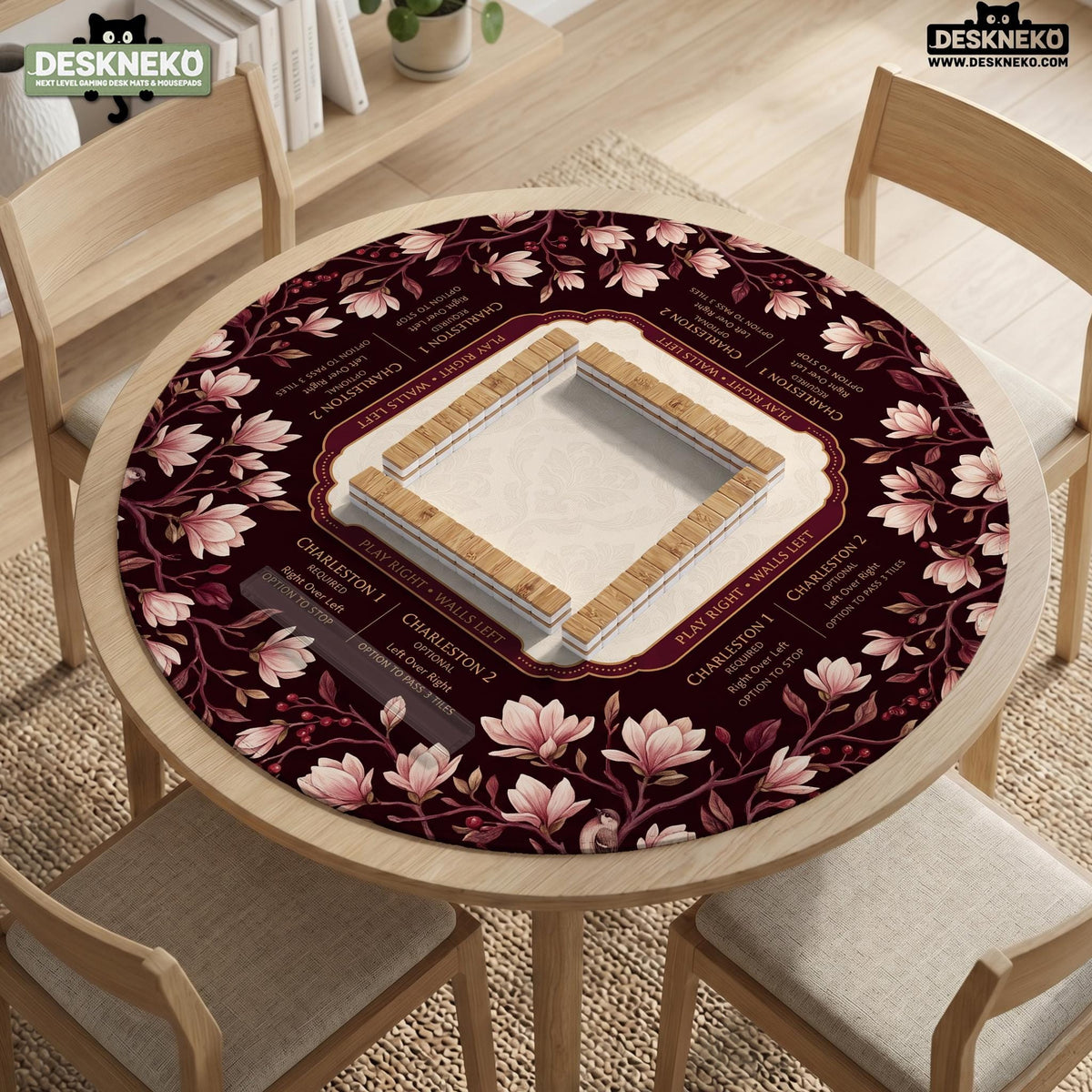 Cream American mahjong mat with a burgundy border of pale pink magnolia blossoms and printed play-direction and passing reminders.