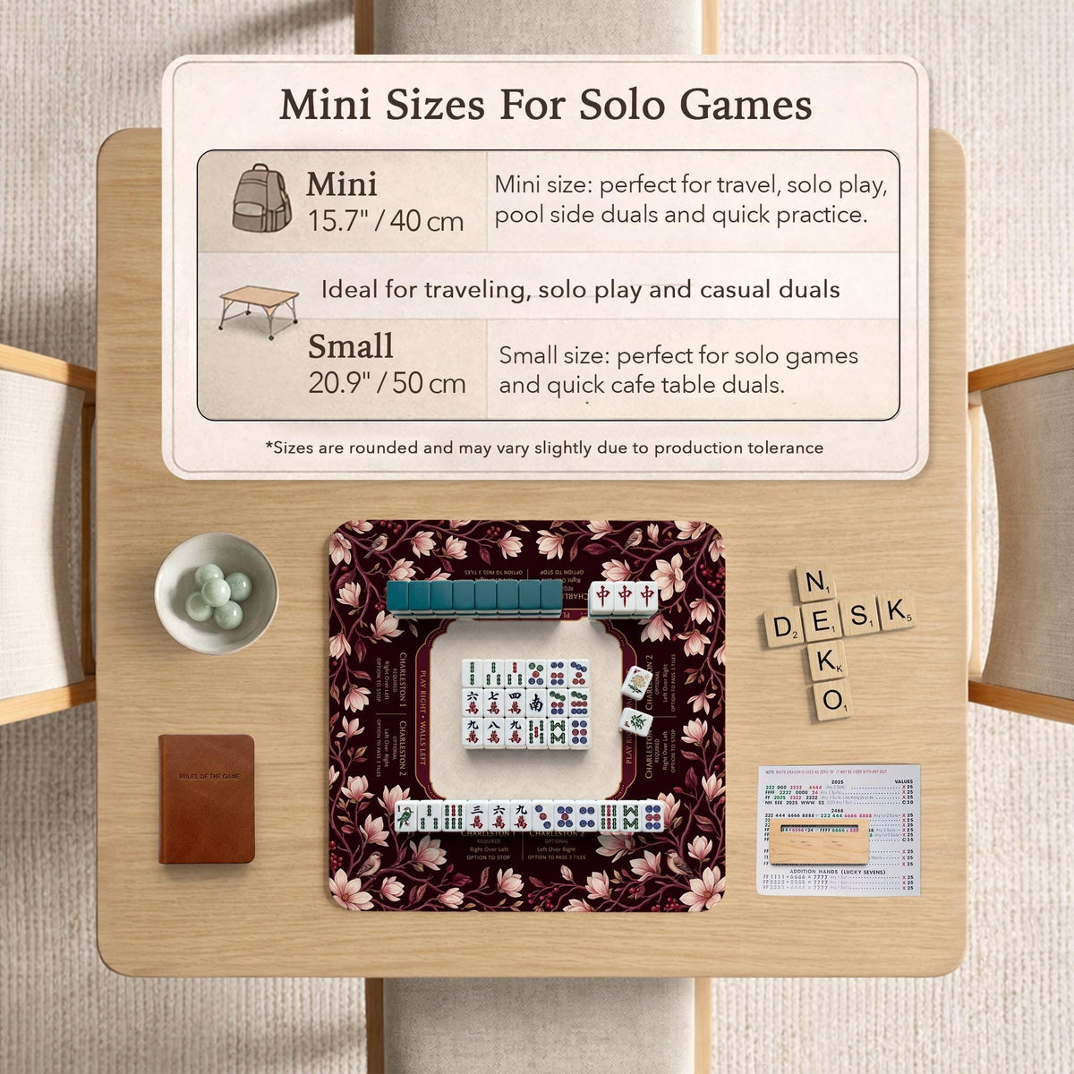 Cream American mahjong mat with a burgundy border of pale pink magnolia blossoms and printed play-direction and passing reminders.