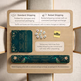 American mahjong mat with a deep teal-green background, peacocks, small cream flowers, leafy branches, and printed play-direction and Charleston reminders.
