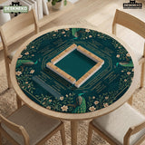 American mahjong mat with a deep teal-green background, peacocks, small cream flowers, leafy branches, and printed play-direction and Charleston reminders.