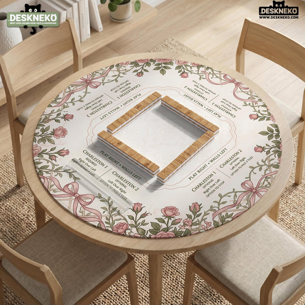 American mahjong mat with an ivory center, printed play-direction reminders, and a border of dusty-pink roses, ribbon bows, and green leaves.