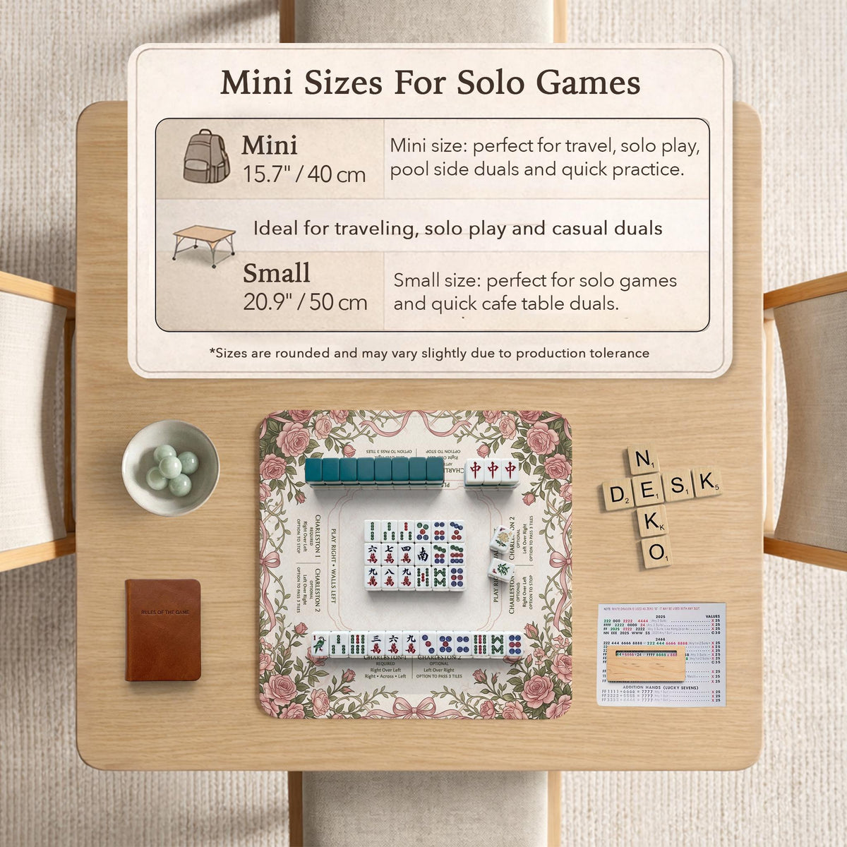 American mahjong mat with an ivory center, printed play-direction reminders, and a border of dusty-pink roses, ribbon bows, and green leaves.