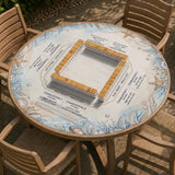 American mahjong mat with a cream center and a coastal border showing oyster shells, scallop shells, starfish, pearl strands, and pale blue sea plants.