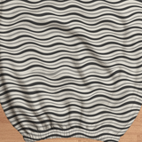 Monochrome Ripple fabric and elastic detail; selected cover option only, chair not included.