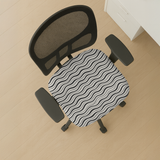 Monochrome Ripple seat-only cover on a mesh-back chair; mesh back and armrests stay bare.