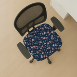 Sakura Nightfall seat-only cover on a mesh-back chair; mesh back and both armrests remain bare.