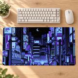 Blue purple Tokyo pixel-art desk mat on an oak workspace