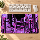 Lilac purple Tokyo pixel-art desk mat on an oak workspace